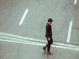 Young-professional-crossing-road