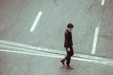 Young-professional-crossing-road